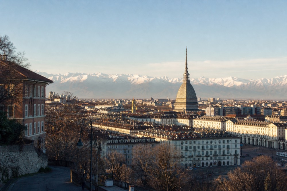 The Turin skyline with the Mole Antonelliana and the Alps beyond.