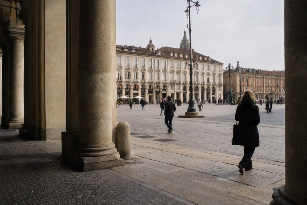Piazza Castello in Turin with baroque facades and the palazzo colonnade.