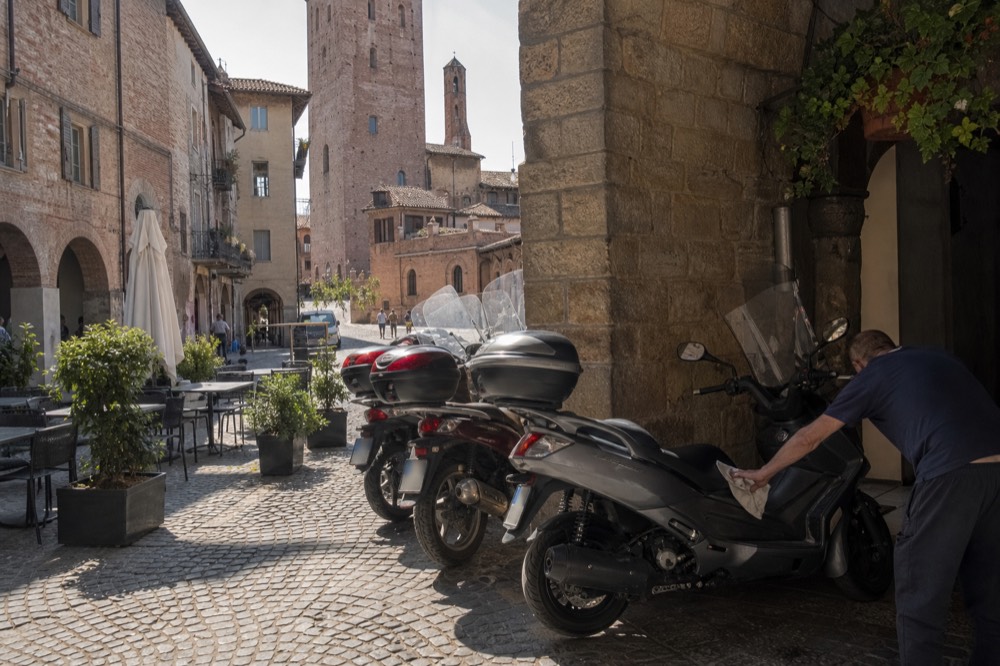 Alba's historic centre with bikes parked outside a café.