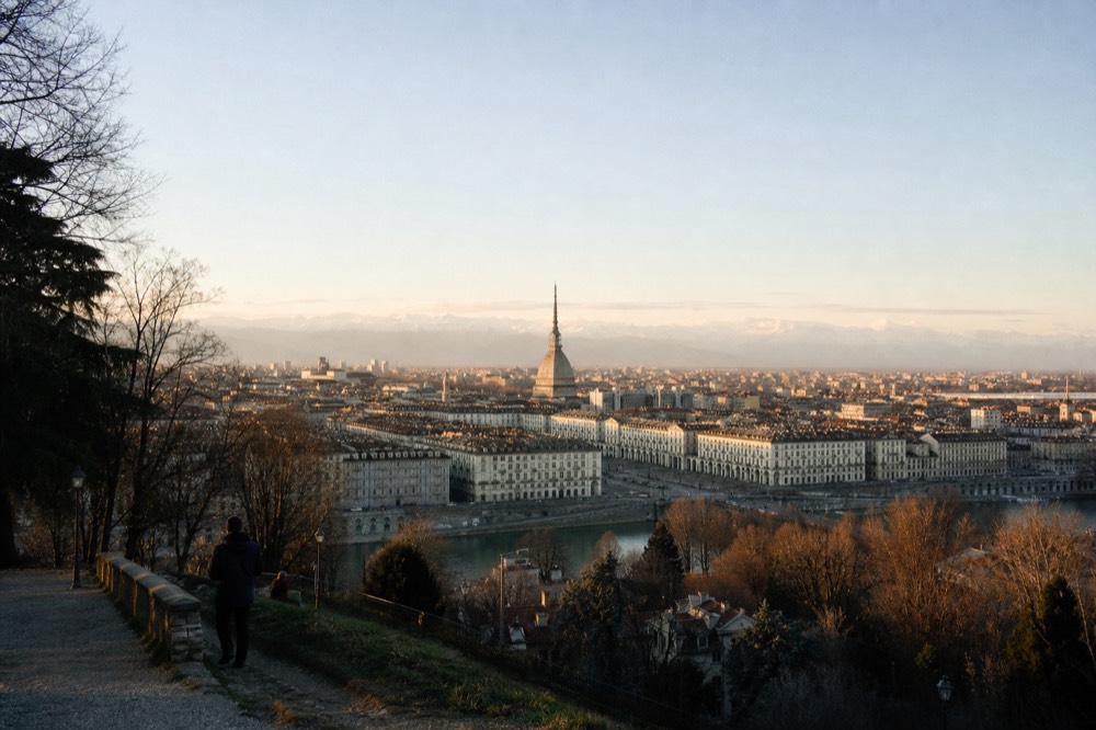 Turin panorama with the Mole Antonelliana and the Alps on the horizon.