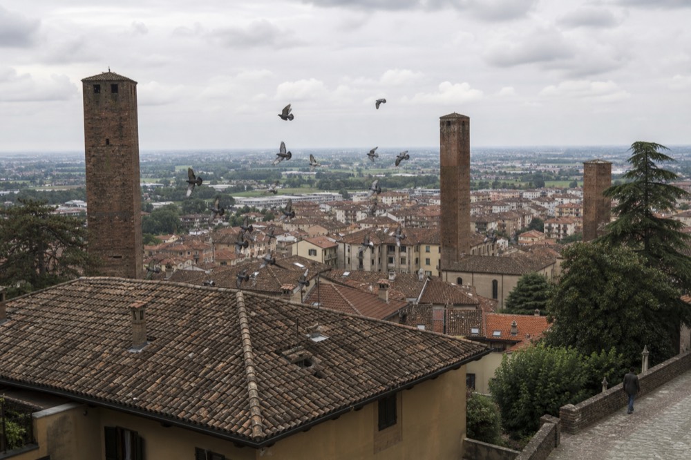 Asti skyline with towers and the Tanaro plain beyond.